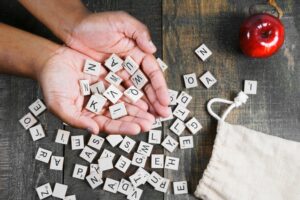 spelling-game-letter-tiles-in-hand